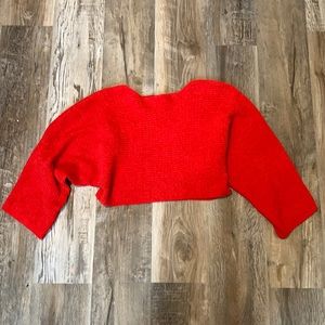 Red cropped oversized knot sweater